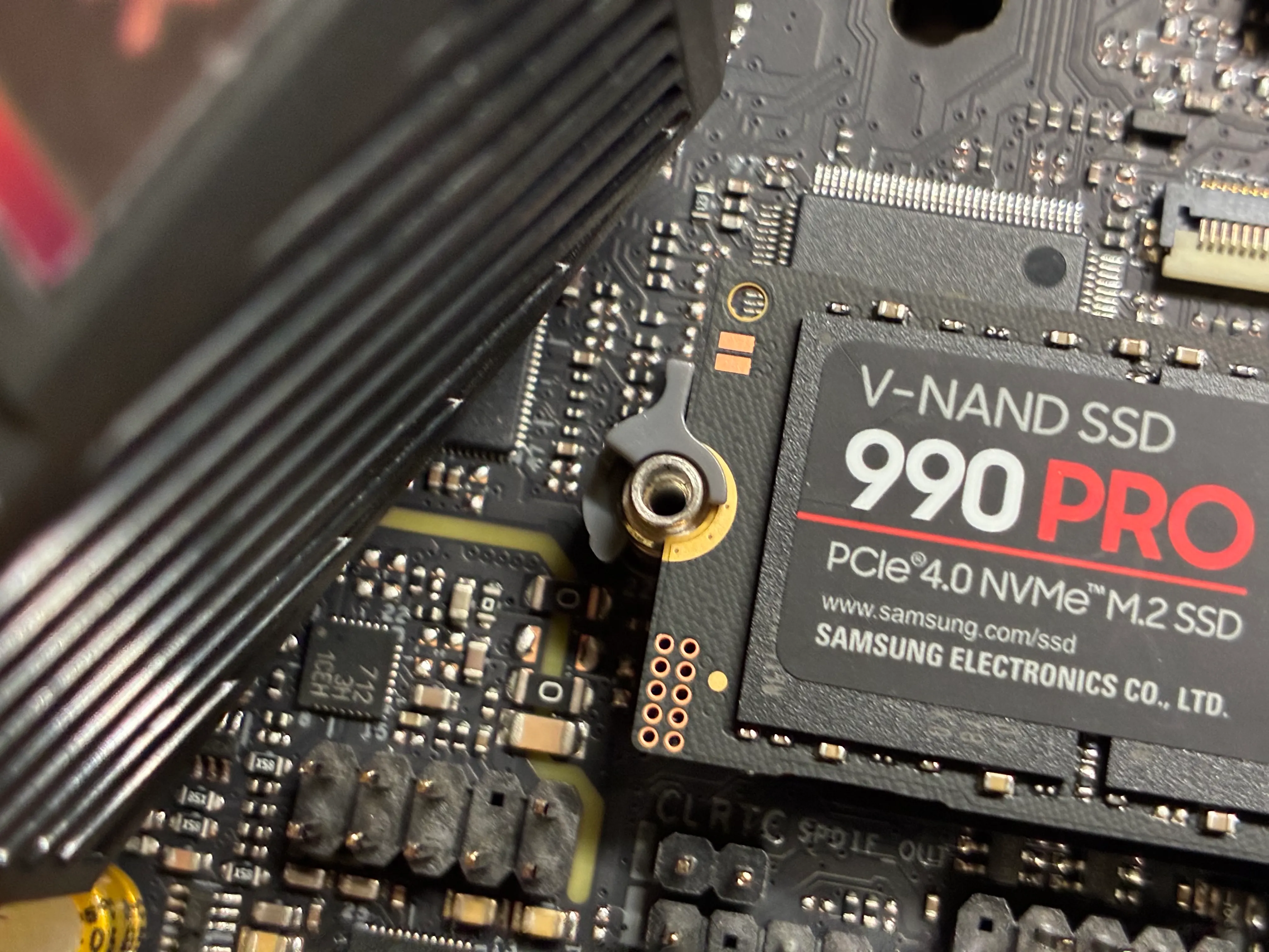 Plastic dodad holding hard drive in place